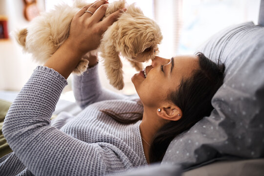 Dogs Just Need You And Love, Thats All. Shot Of A Young Woman Relaxing With Her Dog At Home.