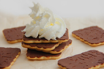 chocolate dessert with cream, chocolate sweets and waffles, cream cake among sweets.