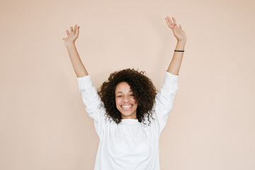 Young african american woman over isolated background celebrating mad and crazy for success with...
