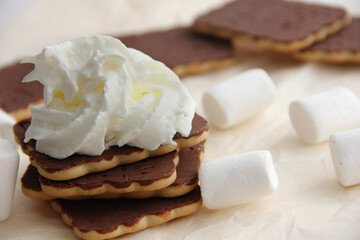 chocolate dessert with cream, chocolate sweets and waffles, cream cake among sweets.