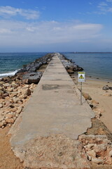 Port's east mole-Arade river mouth-danger warning sign-Ferragudo side. Portimao-Portugal-169