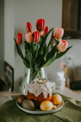 orthodox easter cake with bouquet of tulips 
