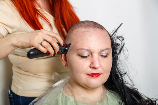 An Orthodox Jewish Hasidic Woman Cries As She Shaves Her Head After Her Wedding.