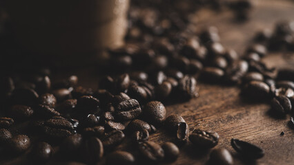 Close-up shot of a heap of coffee beans on wooden surface