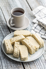 Sweet tahini halva. Turkish dessert on plate.