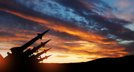 The missiles are aimed at the sky at sunset. Nuclear bomb, chemical weapons, missile defense, a...