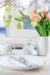 Easter table setting. Easter dinner with colorful Easter eggs. Easter background. Christ is risen