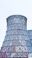 Gas combined heat and power plant with huge pipes, smoke, steam, power stations.