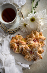 delicious breakfast on sunny morning. Baked puff pastry with toppings