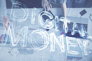 Double exposure of man and woman working together and crypto finance theme hologram. Blockchain business concept. Computer background.