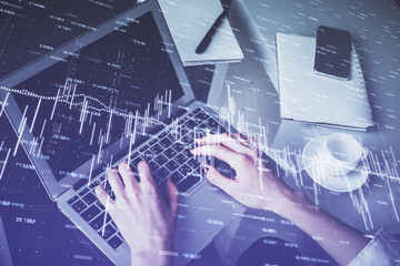 Double exposure of woman hands typing on computer and forex chart hologram drawing. Stock market invest concept.