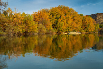 Lake with autumn tree reflections in Centennial Water Park, Idaho