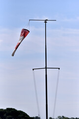Windsock against a cloudy sky