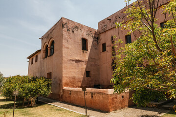 External part of the former convent of the 17th century made of stone and quarry, the dome of the church is also distinguished