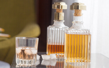 Luxury glass bottles with different alcoholic spirits inside, copy space photo