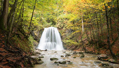 water cascade Josefsthal Schliersee, long exposure shot. autumnal scenery