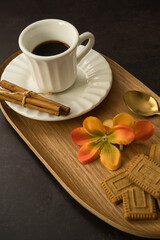 Coffee time with pastries on dark background
