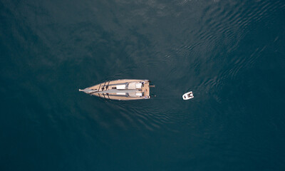 Aerial drone photo of a sail boat in the ope sea