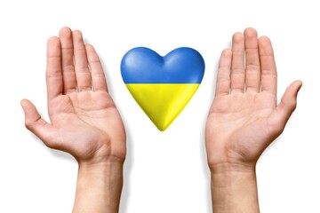 Draw heart with the national flag of ukraine in female hands.
