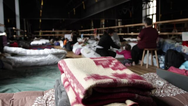 Millions of refugees from the war-torn territories are flees to europe. Mother and child room. Mattresses, pillows, blankets are waiting for refugees, temporary housing during humanitarian disaster