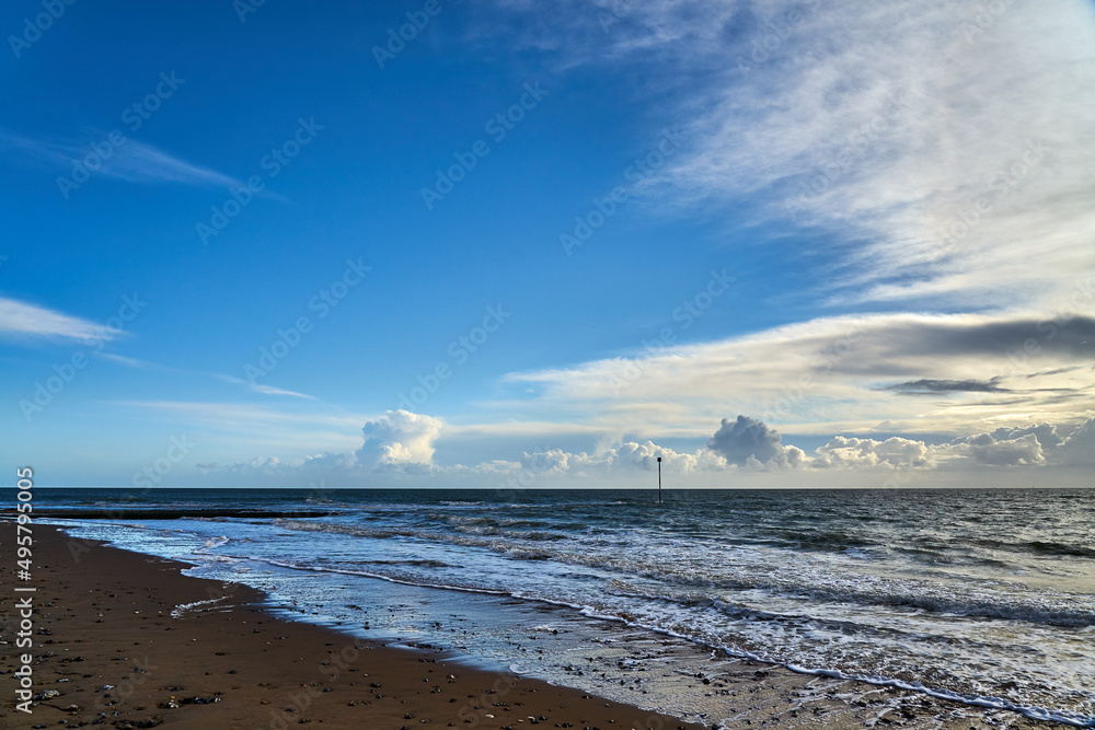 Wall mural beautiful coastline with foamy waves and mesmerizing clo