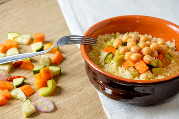 vegan cous cous vith chickpeas and vegetables, traditional dish of north africa