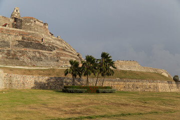 Scenic view of San Felipe de Barajas fortress and palm trees on a gloomy day in Cartagena, Colombia