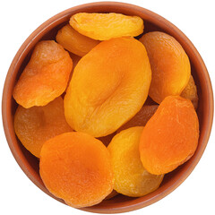 Light dried apricots in a brown ceramic bowl isolated on white background.