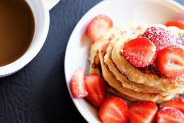 Closeup pancakes with coffee and strawberries food sweet pastry bakery beverage drink