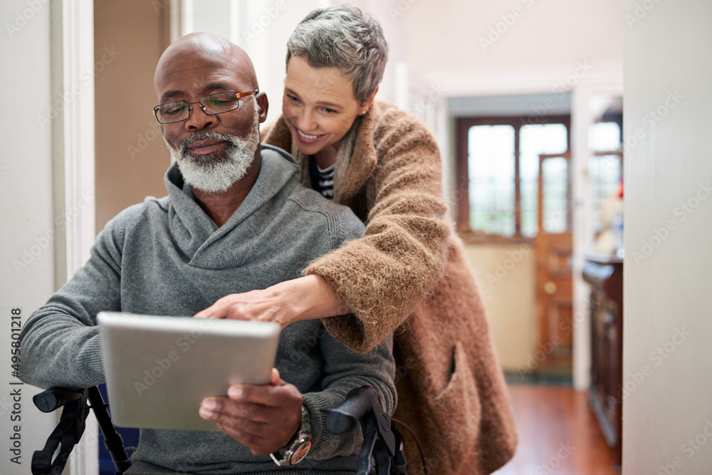 Poster all that matters is that were together. cropped shot of an affectionate senior couple using a tablet