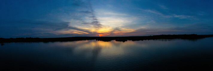 Aerial panorama, a nature background of a famous Ecuadorian lake in the Amazon rainforest with a...