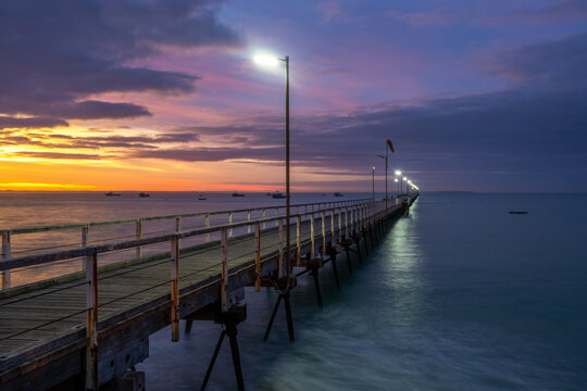 A pastel sunrise over the iconic Beachport Jetty located in the southeast of South Australia taken on February 20th 2022