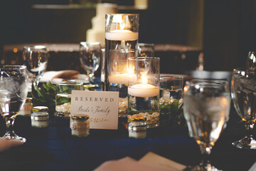 Closeup shot of a set and decorated table with a reserved sign