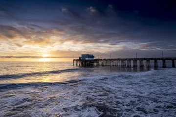 Tuinposter Magnificent sunset view over the pier at Newport Beach, California, USA © Ben White/Wirestock Creators