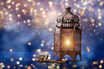 Arabic lantern with burning candle glowing night background. Muslim holy month Ramadan Kareem.