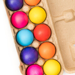 Fototapeta na wymiar Colorful dyed egg cascarones in carton