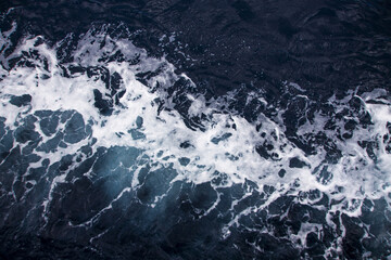 View of foamy waves in the stormy sea