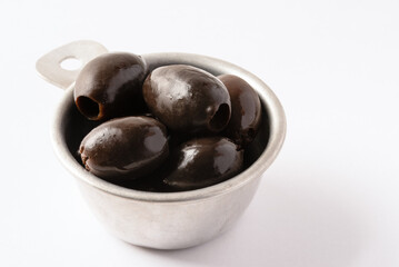 Black Olives in a Measuring Cup