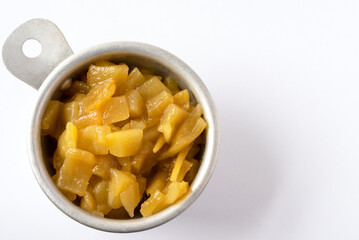 Canned Green Chilis in a Measuring Cup