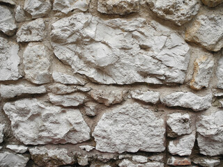 Old wall made of rough natural rock stone. Background for design.    
