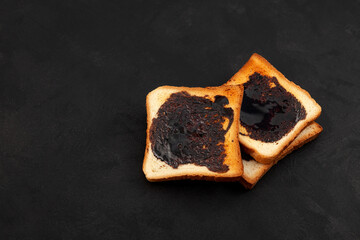 Aussie savory toasts for breakfast with vegemite (thick Australian healthy food spread made from...