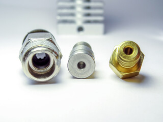 Closeup shot of parts of 3d printer on the white background