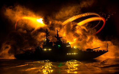 Silhouettes of a crowd standing at blurred military war ship on foggy background. Selective focus.