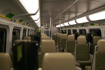 Naklejka na ściany i meble Empty Train Interior at Night
