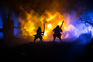 Samurai fighting concept. Silhouette of samurais in duel near tree and old temple. Table decoration...