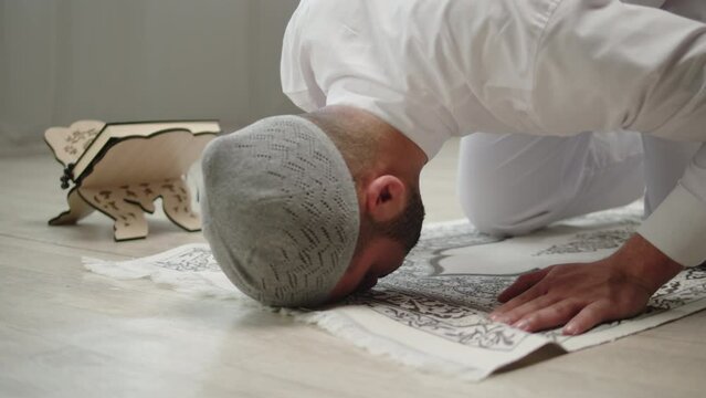 Man praying close-up, dua, islamic religion. Religious holiday Ramadan, holy month. Muslim worship, egyptian making traditional prayer to God, namaz. 