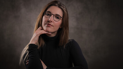 Photo shooting with a young attractive woman in a studio - studio photography