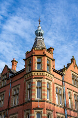 The Old Courts, Wigan town center, with blue skys behind.  Built in the 1880's this building is...
