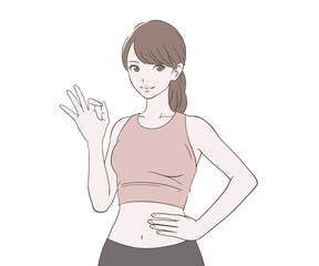 OKマークをつくるスポーツインストラクターの女性