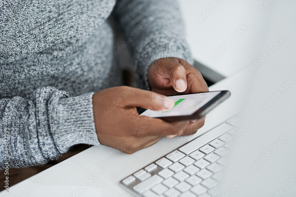 Poster business and technology go together. cropped shot of an unrecognizable businessman sitting alone in 